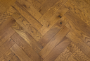 Engineered wood herringbone floor in harvest wheat, varied plank boards