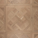 Light oak Versailles wood parquet panel with herringbone geometric pattern, brushed finish