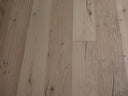 Light oak engineered wood flooring with hand-scraped oiled plank pattern