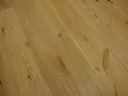 Natural engineered wood flooring planks with brushed oiled finish and visible grain
