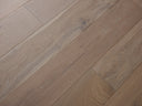 Smoked grey engineered hardwood flooring planks with visible grain and knots