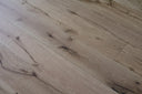 Engineered wood planks in light tan, rustic grain with darker knots and lines