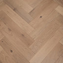 Light oak herringbone wood flooring with lightly brushed matte finish