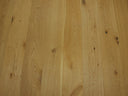 Light natural engineered wood flooring planks showing tight grain and a few knots