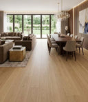 Light oak-look engineered wood flooring planks in a living and dining space