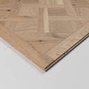 Stacked light oak Versailles parquet panels with beveled edges