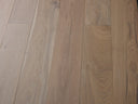 Smoked grey engineered hardwood floor boards with warm grain pattern