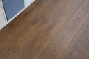 Hazelnut brown engineered wood flooring with detailed grain pattern on planks