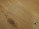 Natural engineered wood flooring planks with prominent knots and natural wood marks