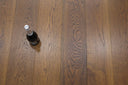 Hazelnut brown UV-oiled wood planks with pronounced grain lines and visible joints