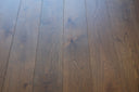 Hazelnut brown engineered wood floorboards with consistent plank pattern