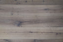 Smoked white engineered wood flooring close-up with knots, grain, and oiled finish