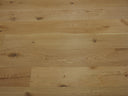 Natural engineered wood flooring planks with long plank layout and visible wood texture