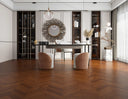 Engineered chevron hardwood flooring in warm golden brandy with diagonal plank pattern