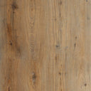 Close-up of light tan wood-look vinyl plank flooring with knots and grain texture