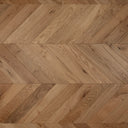 Natural oak chevron wood flooring with herringbone parquet pattern, wider close-up