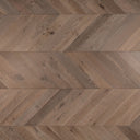 Grey-brown chevron wood floor planks with visible grain and knots
