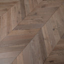 Chevron wood flooring in grey-brown tones with herringbone pattern
