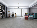 Grey concrete-effect SPC click flooring with subtle veining across large-format tiles
