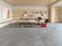 Grey SPC click flooring planks with subtle stone tile effect
