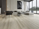 Light gray wood-look SPC flooring planks with plank-grain texture