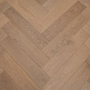 Light oak herringbone parquet wood flooring, close view of plank grain