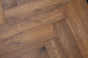 Antique brown herringbone wood flooring boards with tight staggered seams