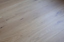Close-up of engineered light grey wood flooring with natural grain pattern