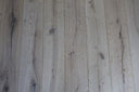 Whitewashed engineered wood flooring planks with brushed matte finish, wide view