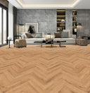 Golden oak herringbone laminate flooring with 12mm boards in a room setting