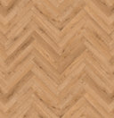 Golden oak herringbone laminate floor pattern close-up with diagonal plank seams