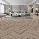 Pebble grey laminate herringbone flooring with chevron plank layout.
