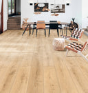 Light oak laminate plank flooring with visible woodgrain and plank seams