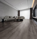Laminate plank flooring in midnight grey with woodgrain pattern, wide view.