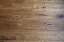 Smoked brushed oiled engineered wood flooring planks with visible grain and knots
