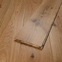 Engineered lacquered hardwood flooring plank edge view with layered stacked boards