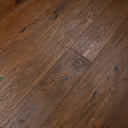 Engineered antique brown distressed wood flooring, varied plank tones and textured grain.