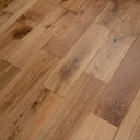 Brushed oiled wood flooring, warm tan-brown planks with natural knots and grain
