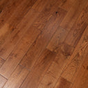 Handscraped solid wood flooring boards with knots and natural grain pattern