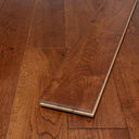 Handscraped wood flooring board end showing tongue-and-groove edge detail