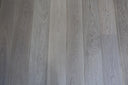 Engineered wood flooring planks, mixed gray and light gray boards with grain