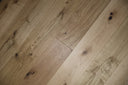 Natural oak engineered wood flooring boards with brushed UV-oiled finish and knots.