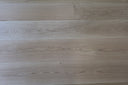 Light oak-look engineered wood plank flooring with brushed matte lacquer finish
