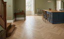 American Oak herringbone wood flooring boards with chevron pattern in open room