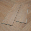 Light oak SPC flooring planks with interlocking edges and built-in underlay