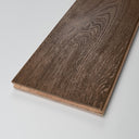 Distressed light brown engineered wood flooring plank showing textured grain and edge