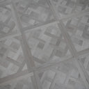 Silver grey SPC vinyl floor panel with parquet herringbone pattern