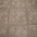 Glacier white SPC flooring panel showing Versailles parquet herringbone design in squares