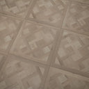 Glacier white SPC floor panel featuring Versailles parquet herringbone pattern and grout lines
