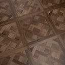Caramel brown parquet wood floor panel with herringbone and diagonal blocks pattern
